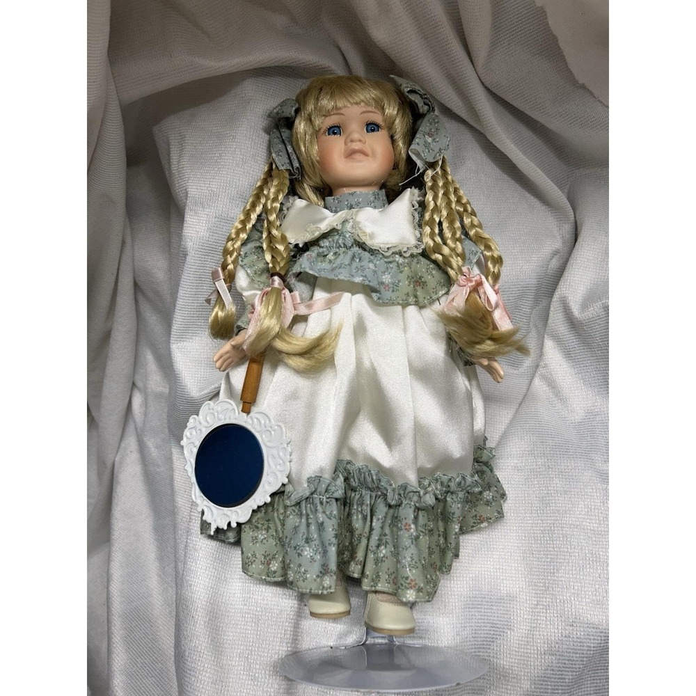 Porcelain Doll With Golden Locks And Blue Eyes. 13 Inches Tall Vintage